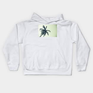 Palm tree against sky low angle point of view monochrome faded image. Kids Hoodie